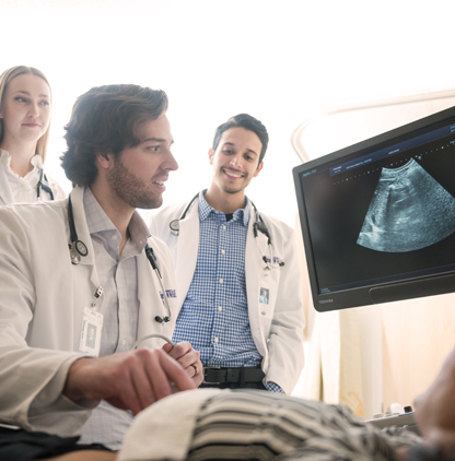 Medical students viewing ultrasound