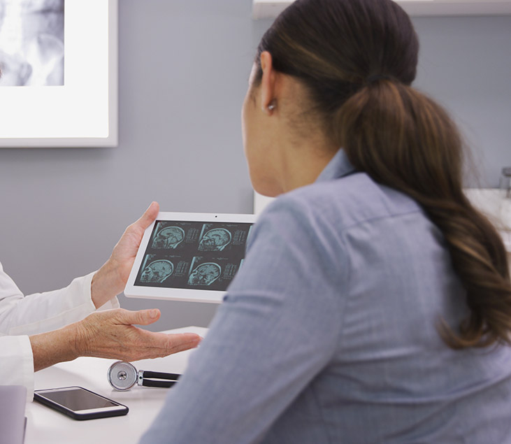 patient reviewing ct scan of cranium
